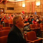 The anticipation builds as Paul waits on the sidelines during his introduction in front of the junior and senior high students in Oberlin, Kansas.