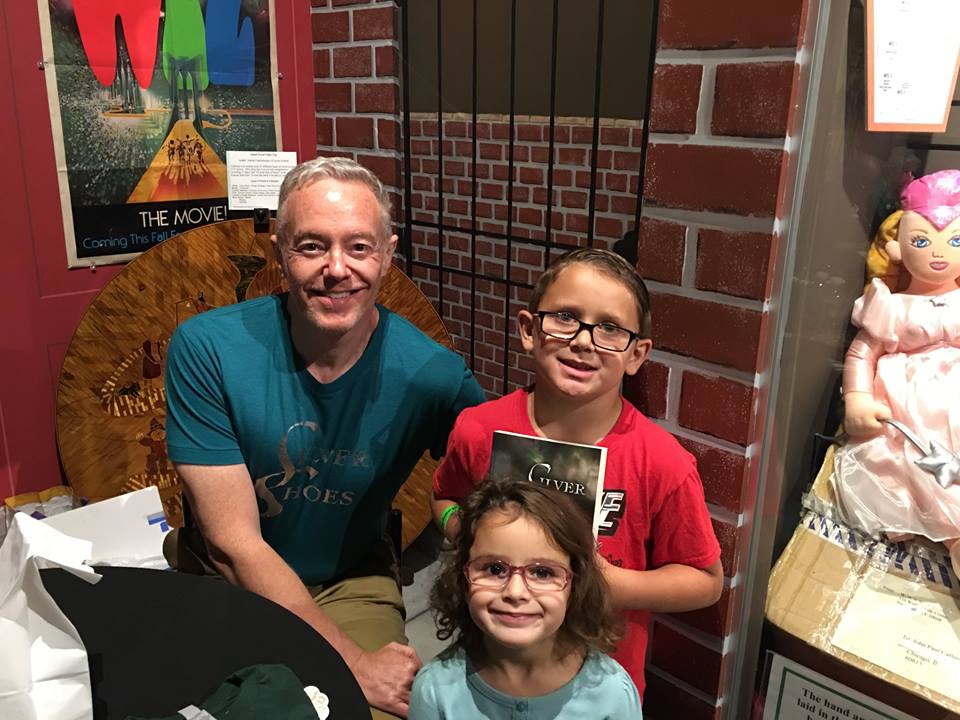"Silver Shoes" author Paul Miles Schneider enjoys a meet-and-greet with young fans during OZtoberFest 2016.