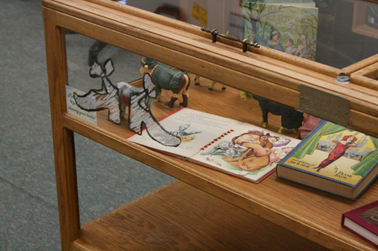 Dorothy’s silver shoes, as depicted in L. Frank Baum’s original book, were painted on a front display case in the Louisburg Public Library.