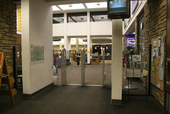 The Lawrence Public Library entrance at night.