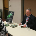 Paul Miles Schneider chats with librarians at the Kansas Library Association's 2011 Annual Convention.