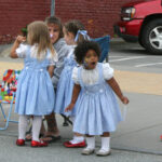 An adorable group of Dorothys watch this year's parade for Oz-Stravaganza! 2012.