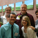 A group of Kansas University education students pose with Paul Miles Schneider, author of "Silver Shoes," at the 2011 KRA annual convention.