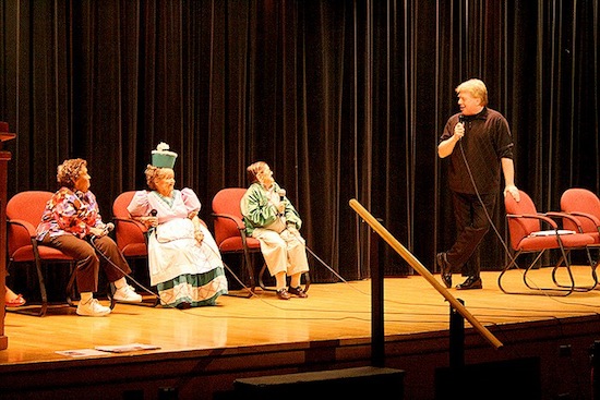 Celebrated author and Oz expert John Fricke interviews the MGM Munchkins on stage at Chittenango High School. Left to right: Myrna Swenson, Margaret Pellegrini, and Karl Slover.