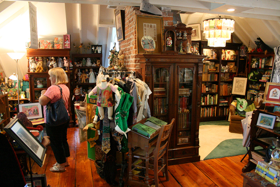 After the reading and signing, we were treated to a tour of Jane's expansive Oz Room, housed on the third floor of her historic home. Good friend Stacey Warner Hatton is seen here perusing the collection.