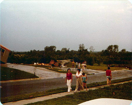 The house across the street from Mike’s and down one to the right. Completely gone except for the cement steps leading to nowhere. The edge of Mike’s Pontiac Bonneville, where we were sitting when all of this happened, is in the lower right foreground of this picture. (Photo courtesy of Michael T. Sheridan.)